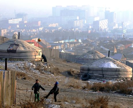 Central Ulan Bator is barely visible due to air pollution. Traditional yurts have been set up on the outskirts of the capital. (Yasuhiro Sugimoto) 